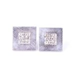 A pair of white metal and diamond earrings, the squared mounts inset with nine round brilliant-cut