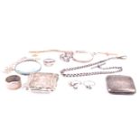 A group of silver and white metal jewellery items, including a silver skull ring, a silver band