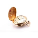 A yellow metal ladies fob watch, of round design, the hinged lid inset with a trillion-cut red stone