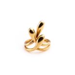 Ilias Lalalounis. An 18ct yellow ring, the stylised mount formed of three twisted lobed terminals,