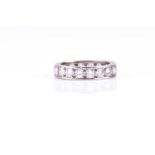 A diamond full hoop eternity diamond ring; the brilliant cut diamonds claw mounted in a continuous