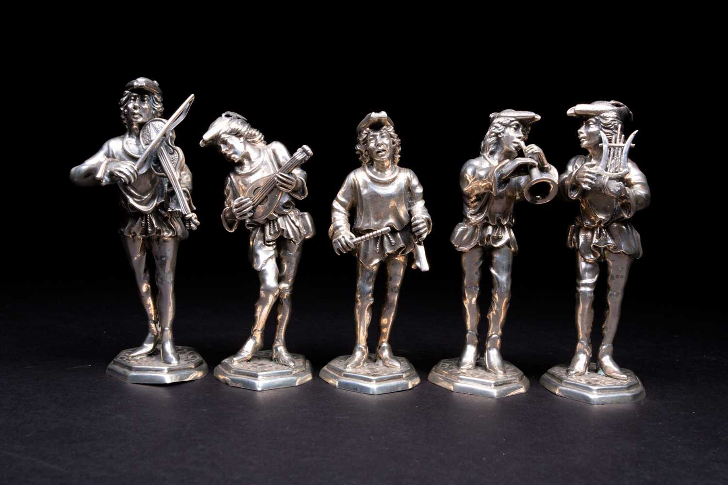 A group of five Spanish silver figures of musicians, 20th century, each dressed as minstrels