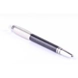 A Montblanc Starwalker ballpoint pen, with metal cap, clear resin logo inset top, and turned resin