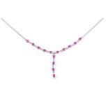 A diamond and ruby pendant necklace, the V shaped centre set with circular cut ruby and diamond