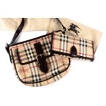 A Burberry handbag, in the Haymarket plaid pattern, approximately 25 cm wide, with long brown