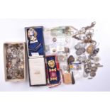 A group of silver and white metal items of jewellery including various pendants, chains, brooches,
