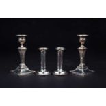 Two pairs of filled silver candlesticks, the tallest 17.5 cm high, London 1897 by Thomas Bradbury