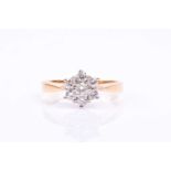 An 18ct yellow gold and diamond floral cluster ring, set with seven round brilliant-cut diamonds, of