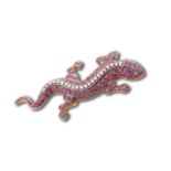 A silver gilt, diamond, and ruby brooch in the form of a lizard, set with round-cut rubies and