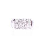 A diamond set dress ring, the wide convex 9ct white gold band pavé set with brilliant cut diamonds