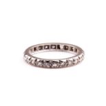 An 18ct white gold and diamond eternity band, set with round-cut diamonds of approximately 1.5 mm