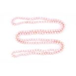 An opera length pale pink pearl necklace, the cultured pearls approximately 9 mm diameter,