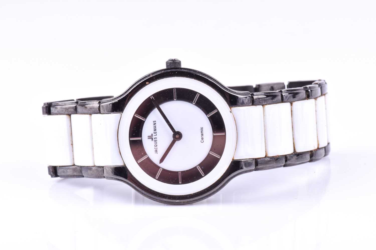A Jacques Lemans ceramic wristwatch, the black and white minimalist dial on black and white