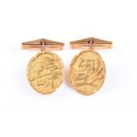 A pair of yellow metal cufflinks, the oval plaques with Chinese characters, marked 9ct to sides.