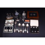 A mixed collection of silver and white metal items to include flatware, napkin rings, a Christofle