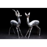 A Spanish silver Stag and Doe, mid 20th century, modelled standing in alert pose, struck to the