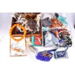 A large group of costume jewellery items, to include various necklaces, beads, brooches, rings,