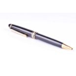 A Montblanc Meisterstuck Pix ballpoint pen, with black resin body and cap, and gilt metal mounts.