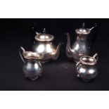 A Continental white metal four-piece teaset, marked 'Silver', comprising teapot, hot water pot,