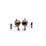 Deakin & Francis. An unusual pair of 18ct white gold novelty cufflinks, designed as spinning globes,