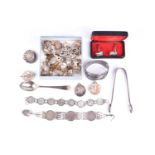 A small group of silver and white metal jewellery, to include two silver charm bracelets, various
