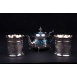 A George VI silver bachelor's teapot, Sheffield 1938 (maker indisitnct), 12 cm high, together with a