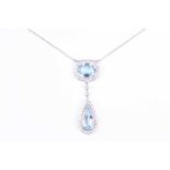 An 18ct white gold, diamond, and blue topaz drop pendant necklace, set with a cushion cut and pear-