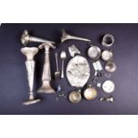 A collection of silver findings, including pocket watch cases, ingots, charms, vases (a/f) and