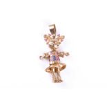 A 9ct gold Angelica Pickles rugrats pendant, the articulated character set with coloured glass