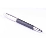 A Montblanc Starwalker ballpoint pen, with metal cap, textured body, and clear resin logo inset top,