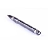 A Montblanc ballpoint pen, with black resin body and black polished metal mounts, with clear rein