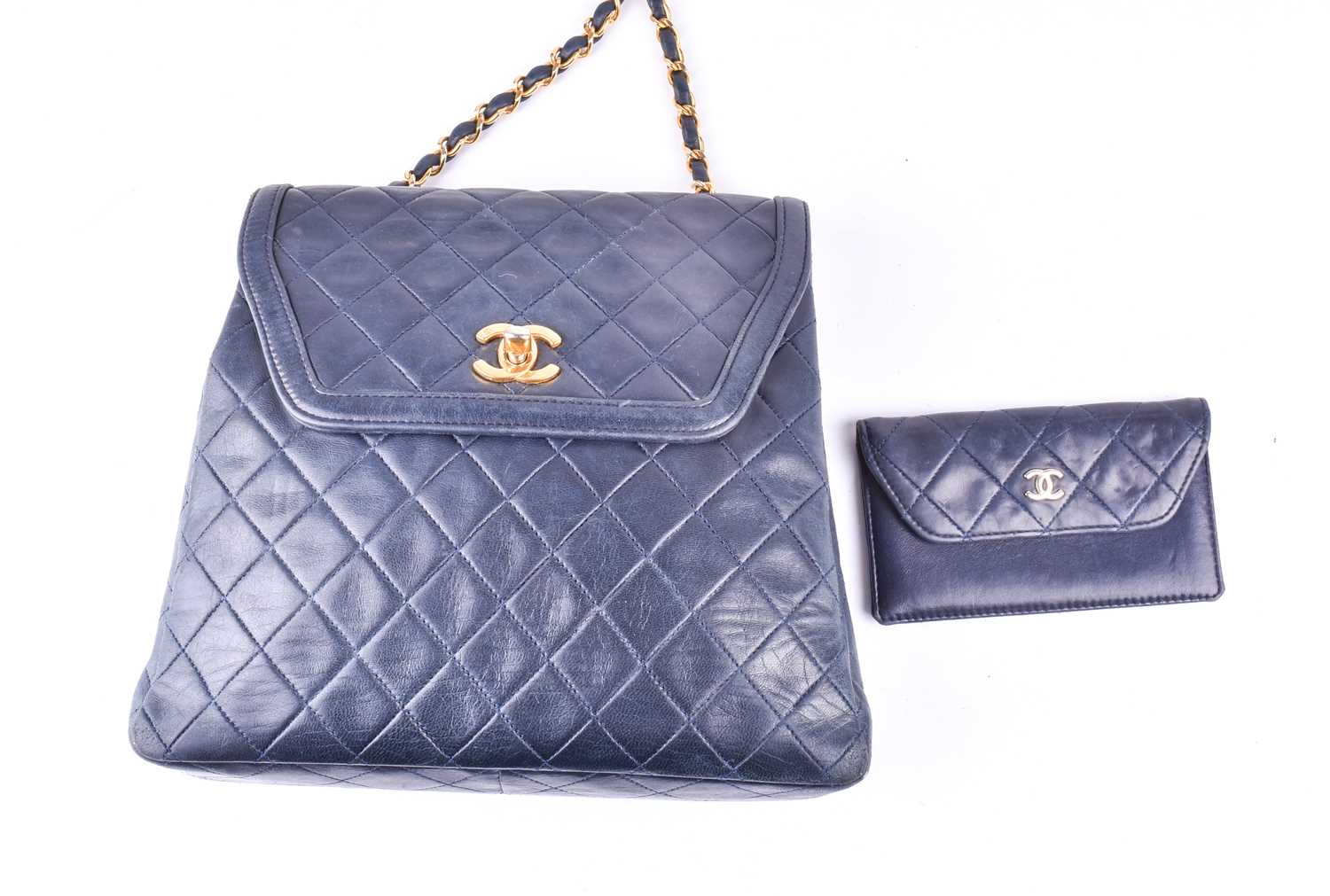 Chanel. A classic quilted leather handbag, of tapered square design, with gold tone CC logo clasp,