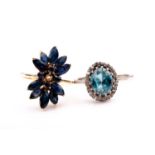 A 9ct yellow gold and sapphire dress ring, set with marquise and round-cut stones (one lacking),