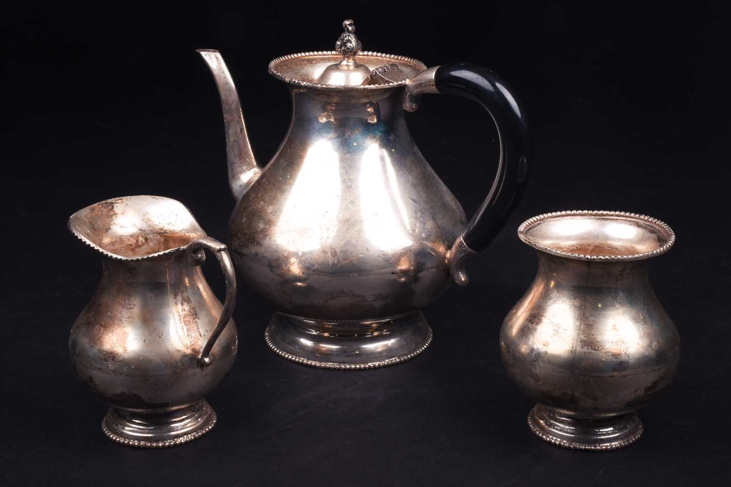 A Continental white metal three-piece teaset, marked 'Silver', comprising teapot, sucrier and - Image 2 of 3