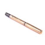 A yellow metal mounted Waterman's fountain pen, with striped decoration, with personalised
