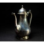 A QEII silver coffee pot, Birmingham 1968 by Barker Ellis Silver Co, in the Georgian style, 26.5