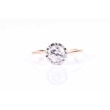 A single stone diamond ring, the brilliant cut diamond in 18ct scalloped eight claw setting, tapered