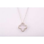 An 18ct white gold and diamond pendant, of quatrefoil design, the openwork mount inset with small