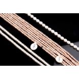 Nine strands of unstrung freshwater pearls, including white and pink examples, various sizes. (qty)