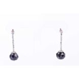 A pair of Art Deco onyx and diamond pendant earrings, the multi-faceted onxy drops with old cut