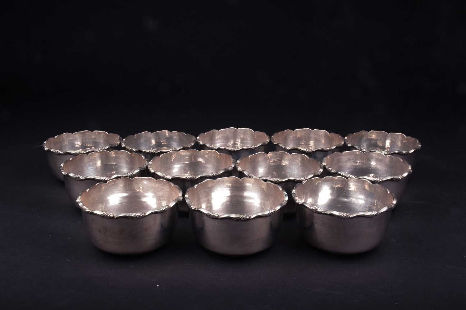 A set of twelve Continental silver finger bowls, each with frilled edge, marked 'Silver' to base,