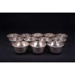 A set of twelve Continental silver finger bowls, each with frilled edge, marked 'Silver' to base,
