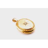 A Victorian yellow metal oval-shaped locket pendant, inset with a rose-cut diamond of