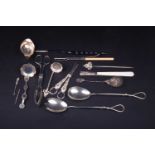 A mixed group of silver and white metal items, to include a William IV silver toddy ladle, coin