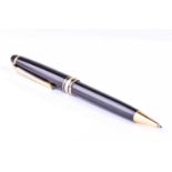 A Montblanc Meisterstuck Pix ballpoint pen, with black resin body and cap, and gilt metal mounts.