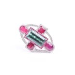 An 18ct white gold, diamond, tourmaline, and ruby cocktail ring, the elongated oval mount centred