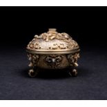 A Continental silver gilt trinket box, marked '925', of circular form on three scroll feet, the