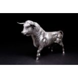 A large Spanish silver bull, 20th century, realistically modelled, its tail partially raised, struck