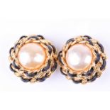 Chanel. A pair of gold tone and faux pearl earrings of plaited leather and chain design, 3.5 cm