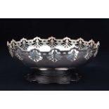 A George V silver fruit bowl, Birmingham 1921 by Gorham & Co, with pierced foliate rim and lobed